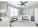 Adorable Bedroom with white crib, area rug and lots of natural light at 1751 Stanwood Se Ave, Atlanta, GA 30317