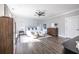 Bright main bedroom offers an airy feel, showcasing modern furnishings, neutral tones, a ceiling fan and wood laminate floors at 1751 Stanwood Se Ave, Atlanta, GA 30317