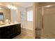 Bathroom showcases a large soaking tub, double vanity, and a glass enclosed shower at 5433 Cascade Sw Rdg, Atlanta, GA 30336
