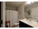 Bright bathroom featuring a modern vanity, white countertop, and bathtub with white shower curtain at 5433 Cascade Sw Rdg, Atlanta, GA 30336