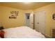 Bedroom with white walls, double closets, and decorative wall art at 5433 Cascade Sw Rdg, Atlanta, GA 30336