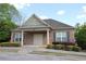 Charming community clubhouse featuring a brick facade, covered entrance, and well-maintained landscaping at 5433 Cascade Sw Rdg, Atlanta, GA 30336
