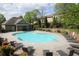 Inviting community pool surrounded by lounge chairs, lush greenery, and well-maintained landscaping at 5433 Cascade Sw Rdg, Atlanta, GA 30336