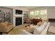 Bright living room boasting a fireplace, large windows, and comfortable seating arrangement at 5433 Cascade Sw Rdg, Atlanta, GA 30336