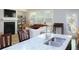 Bright living area featuring granite countertops, a fireplace, and an adjacent dining space at 5433 Cascade Sw Rdg, Atlanta, GA 30336