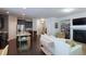 Open-concept living space featuring a modern kitchen, cozy seating area, and a fireplace at 5433 Cascade Sw Rdg, Atlanta, GA 30336