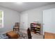 Office with neutral walls featuring a built-in bookshelf and natural lighting at 5433 Cascade Sw Rdg, Atlanta, GA 30336