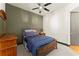 Bedroom featuring carpeted floor, wood furniture, ceiling fan and door at 747 Ralph Mcgill Ne Blvd # 326, Atlanta, GA 30312