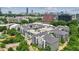 Scenic view of the apartment complex with a rooftop parking area amidst lush greenery and the city skyline at 747 Ralph Mcgill Ne Blvd # 326, Atlanta, GA 30312