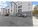 Modern apartment complex featuring garages, balconies, and convenient parking spaces in front of the building at 747 Ralph Mcgill Ne Blvd # 326, Atlanta, GA 30312