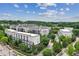 An exterior building view shows modern architecture, lush trees, and neatly arranged parking at 747 Ralph Mcgill Ne Blvd # 326, Atlanta, GA 30312