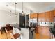 Kitchen featuring modern appliances, breakfast bar, and open layout into dining area at 747 Ralph Mcgill Ne Blvd # 326, Atlanta, GA 30312