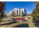 A colorful playground with benches and a walkway is surrounded by lush trees and greenery at 747 Ralph Mcgill Ne Blvd # 326, Atlanta, GA 30312