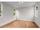 Bright bedroom featuring hardwood floors, neutral walls, recessed lighting and large windows, creating a serene ambiance at 1186A Francis Nw St, Atlanta, GA 30318