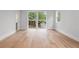 Bright bedroom with hardwood floors and large windows overlooking the outdoor landscape at 1186A Francis Nw St, Atlanta, GA 30318