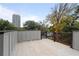 Large deck offering scenic views of the city skyline and autumn foliage, enhancing the property's outdoor appeal at 1186A Francis Nw St, Atlanta, GA 30318