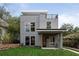 Stunning modern home with sleek gray siding, manicured lawn, and rooftop deck at 1186A Francis Nw St, Atlanta, GA 30318