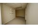 Finished basement area with carpeted floors, drop ceiling, and built-in shelving at 1270 Tribble Walk Ct, Lawrenceville, GA 30045