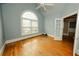 Sunlit bedroom features hardwood floors, a vaulted ceiling, and a large window that fills the room with natural light at 1270 Tribble Walk Ct, Lawrenceville, GA 30045