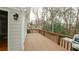 Spacious wooden deck with wooded views provides a relaxing outdoor space at 1270 Tribble Walk Ct, Lawrenceville, GA 30045