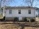 Back of the home with a concrete foundation and vinyl siding at 2305 Phillips Rd, Lithonia, GA 30058