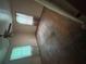 Empty bedroom with hardwood floors, two windows with blinds, and a ceiling fan at 2628 Northview Ave, Decatur, GA 30032