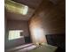Bedroom featuring hardwood floors, one window with blinds, and an air conditioning unit at 2628 Northview Ave, Decatur, GA 30032