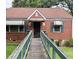 Charming brick home featuring a unique walkway, awning-covered windows and front door at 2628 Northview Ave, Decatur, GA 30032