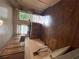 Compact kitchen with wooden cabinetry, sink, window, hardwood floors, and a door to the backyard at 2628 Northview Ave, Decatur, GA 30032