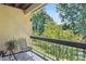 Balcony seating with view to wooded area and a balcony rail at 5306 Brooke Ridge Dr, Atlanta, GA 30338