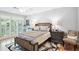 Bright bedroom with shuttered windows, a unique bed frame and wood floors at 5306 Brooke Ridge Dr, Atlanta, GA 30338