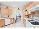 Bright kitchen with light wood cabinets and modern appliances, flowing into an open living space at 5306 Brooke Ridge Dr, Atlanta, GA 30338