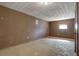 Spacious unfinished basement with a textured ceiling and ample space for customization at 1933 Wedgewood Dr, Stone Mountain, GA 30088