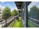 Outdoor balcony with artificial turf, offering a view of the street and surrounding greenery at 200 N Highland Ne Ave # 207, Atlanta, GA 30307