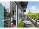 Private balcony features seating and green space with views of the surrounding neighborhood at 200 N Highland Ne Ave # 207, Atlanta, GA 30307