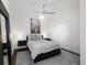 Cozy bedroom with a ceiling fan, decorative artwork, and minimalist floating nightstands at 200 N Highland Ne Ave # 207, Atlanta, GA 30307
