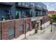 Exterior view of a brick building with blue painted siding and private balconies at 200 N Highland Ne Ave # 207, Atlanta, GA 30307