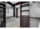 Walk-in closet with custom shelving, drawers, and ample storage space at 200 N Highland Ne Ave # 207, Atlanta, GA 30307