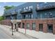 Exterior of a renovated brick building with multiple balconies and street-side appeal at 200 N Highland Ne Ave # 207, Atlanta, GA 30307