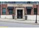 Exterior shot of a building with brick facade, vintage architectural details, and black awnings at 200 N Highland Ne Ave # 207, Atlanta, GA 30307