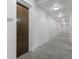 Hallway with carpet and a view of a door labeled 207 at 200 N Highland Ne Ave # 207, Atlanta, GA 30307