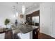 Modern kitchen featuring granite countertops, stainless steel appliances, and bar seating at 200 N Highland Ne Ave # 207, Atlanta, GA 30307