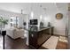 Modern kitchen flows into a spacious living area with hardwood floors and stainless steel appliances at 200 N Highland Ne Ave # 207, Atlanta, GA 30307