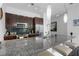 Modern kitchen featuring stainless steel appliances, granite countertops and stylish pendant lighting at 200 N Highland Ne Ave # 207, Atlanta, GA 30307