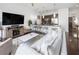 Bright living room features hardwood floors, modern furnishings and an open-concept layout to the kitchen at 200 N Highland Ne Ave # 207, Atlanta, GA 30307