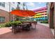 Inviting outdoor patio area featuring a large table with chairs and a grill at 200 N Highland Ne Ave # 207, Atlanta, GA 30307