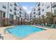 Enjoy the sun in this community pool with multiple lounge chairs for optimal relaxation at 200 N Highland Ne Ave # 207, Atlanta, GA 30307