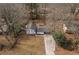 An aerial view of the home showcasing the property layout and the surrounding tree coverage at 545 Birch Ln, Lawrenceville, GA 30044