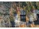 Overhead view of a home showing driveway and roof with mature trees at 100 Reed St, Canton, GA 30114