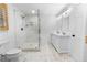 Bathroom featuring a glass-enclosed shower, a toilet, and a double sink vanity at 100 Reed St, Canton, GA 30114
